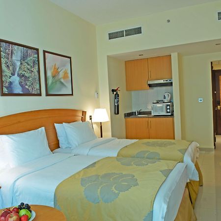 Golden Tulip Sharjah Aparthotel Exterior foto