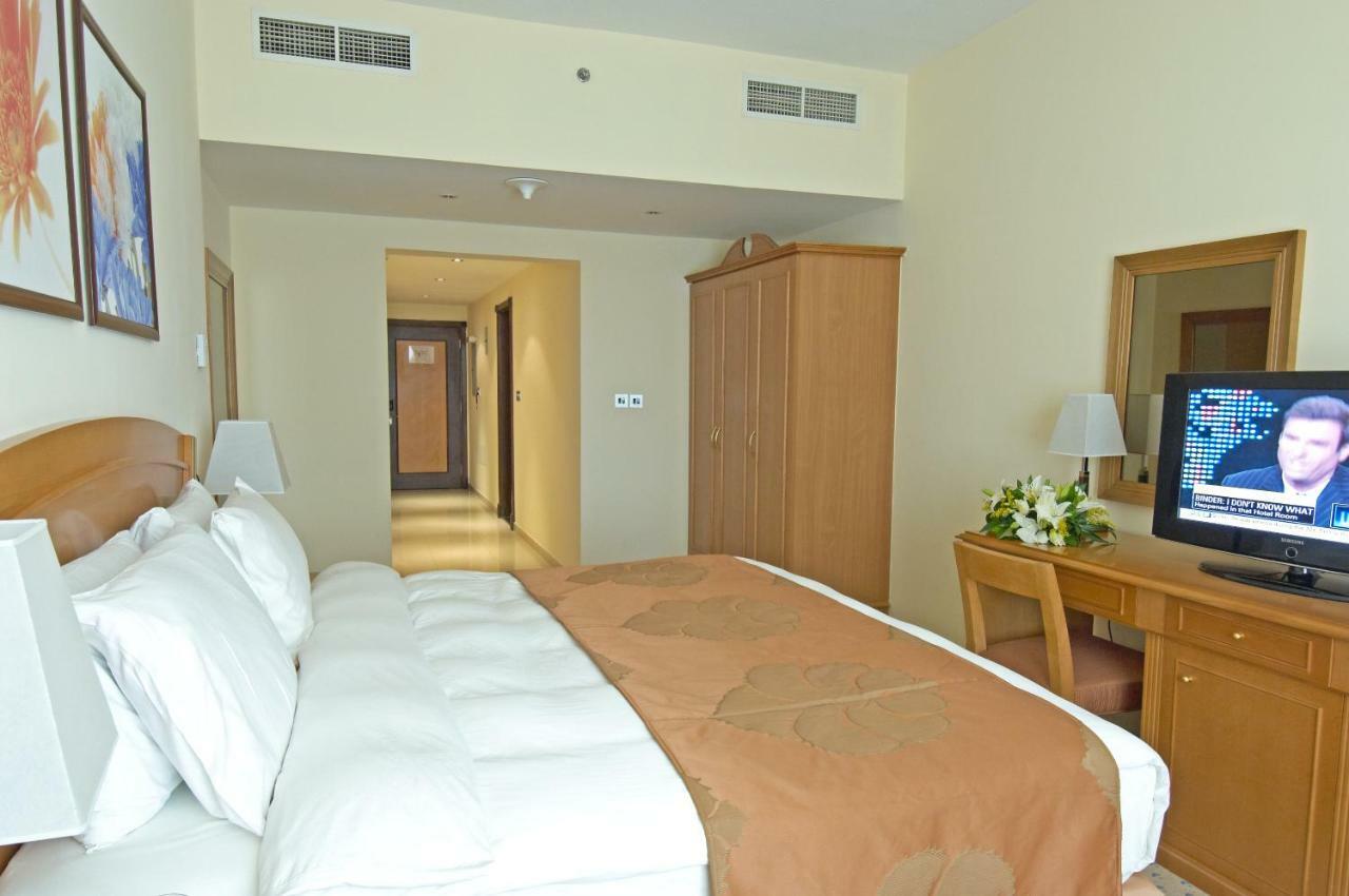 Golden Tulip Sharjah Aparthotel Exterior foto